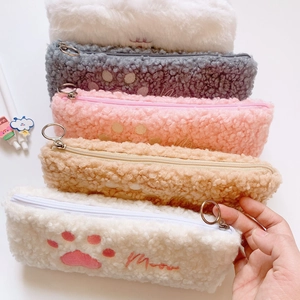 Detailed pile of plush cat paw pencil cases in white gray pink and khaki with Meow embroidery