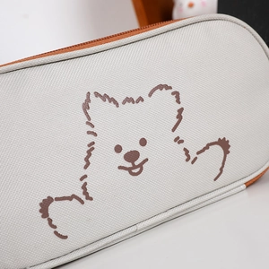 Close-up of canvas texture and cute puppy pattern on a large capacity pencil case