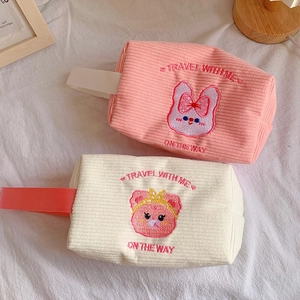Cute corduroy travel makeup bag with cartoon embroidery and sturdy handle straps