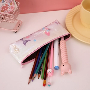 Detailed view of iridescent mermaid pencil case with pearl charm and colorful stationery