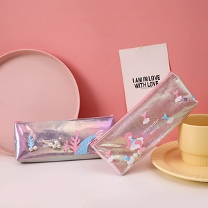 Detail of holographic mermaid pencil case with 3D sea charms and metallic finish