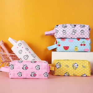 Detail of assorted cartoon canvas pencil cases with portable handles and zip closure