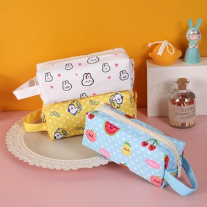 Three multi-patterned large capacity pencil cases with side handles for students