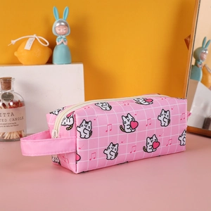 Macro detail of pink canvas pencil case with cute cat print and side carry handle