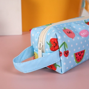 Close-up of a blue fruit pattern pencil case with canvas texture and sturdy zipper