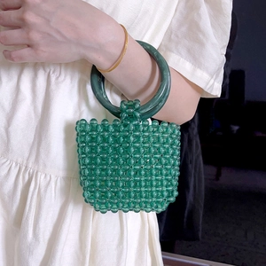 Green acrylic beaded handbag with emerald textured ring handle and handwoven pattern