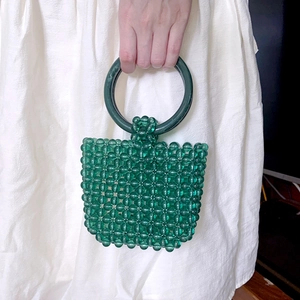 Green handmade acrylic beaded handbag with retro woven pattern and round top handle