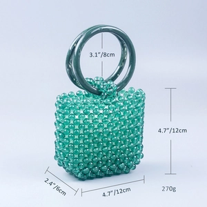 Detailed view of handmade green acrylic beaded handbag with size and weight measurements
