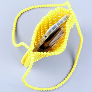 Handmade yellow acrylic beaded crossbody bag with hollow grid for a trendy street look