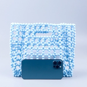 Sky blue handmade acrylic beaded handbag with hollow woven pattern and large capacity