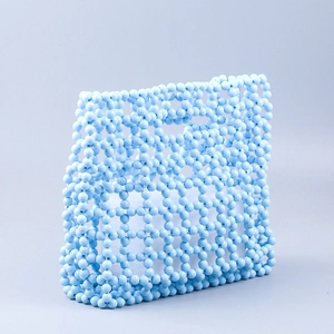 Light blue handmade acrylic beaded tote bag with a hollow woven grid pattern and top handle