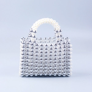 Handmade beaded square handbag featuring silver acrylic and white pearl accents