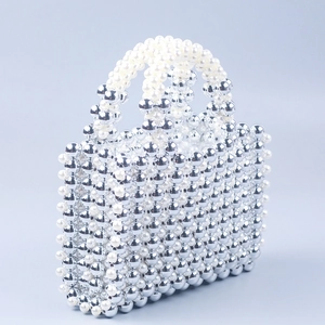 Silver and pearl beaded square handbag with elegant top handles and modern aesthetic