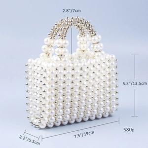 Detailed dimensions of pearl beaded handbag with white and gold beads on blue background