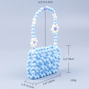 Macro shot of blue beaded mini handbag showing 10x8x3.5cm dimensions and weight