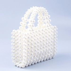 Handmade woven faux pearl handbag in elegant rectangular shape with double handles