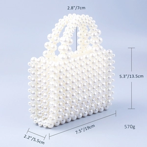 Detailed size specifications for a handmade white pearl beaded handbag showing dimensions