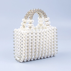 Handmade pearl beaded handbag with large white acrylic pearls and silver bead accents