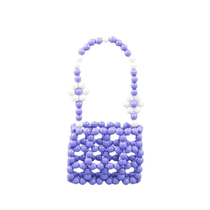 Lavender handmade beaded handbag with white flower details and openwork grid design