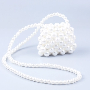 Elegant handmade white pearl beaded mini crossbody bag with a long pearl shoulder strap