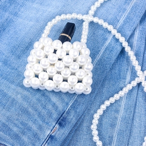 Mini white handmade pearl beaded crossbody bag for lipstick with a long pearl strap