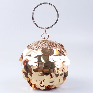Detail of gold sequin evening bag featuring large metallic scales and rhinestone ring handle