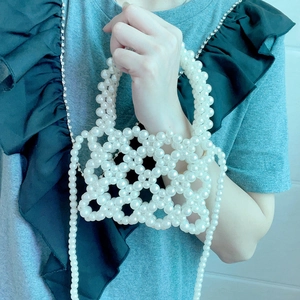 Detail view of handmade hollow square beaded pearl bag with long chain strap