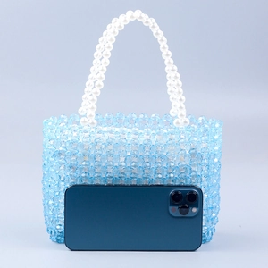 Handmade blue acrylic beaded handbag with white pearl handles and a compact square shape