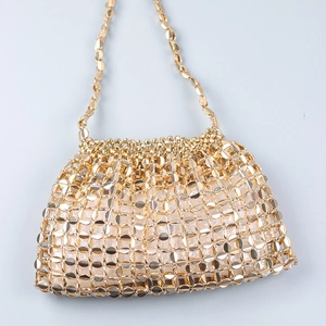 Detail view of woven gold metallic disc mesh handbag with beaded trim and chain strap