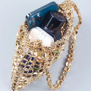 Chic handmade gold beaded woven handbag featuring a metallic finish and chain strap