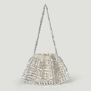 Detail of silver metallic sequin mesh bag with creamy white satin fabric liner and strap