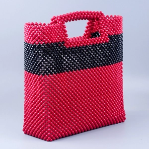 Handmade beaded clutch bag in red and black glossy acrylic with top handle design
