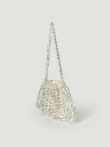 Detailed view of silver sequin tote bag showing metallic beadwork and soft fabric lining
