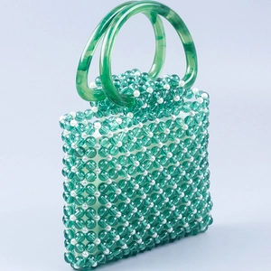 Handmade green and white beaded hollow handbag with green marble resin ring handles