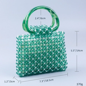 Detailed size view of green acrylic beaded handbag with measurements and white lining