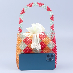 Handmade colorful beaded handbag with floral pattern and satin drawstring liner