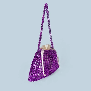 Close-up of purple beaded woven bag featuring a satin drawstring liner and bead details