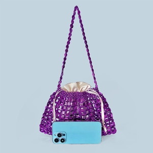 Detail of purple beaded handbag featuring a satin drawstring pouch and shoulder strap