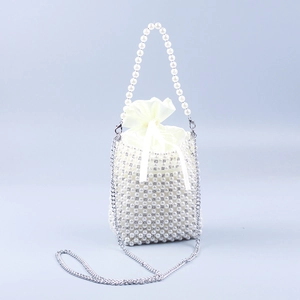 Handmade pearl bucket bag with satin drawstring liner and silver chain strap