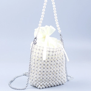 Elegant pearl beaded bucket bag with silver chain and white satin drawstring pouch inside