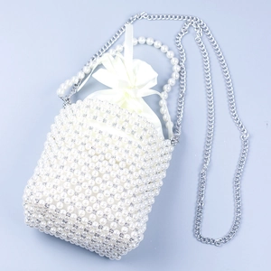 Elegant pearl beaded bucket bag with drawstring satin lining and silver chain strap