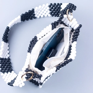 Handmade black and white checkered beaded handbag with zipper and wide shoulder strap