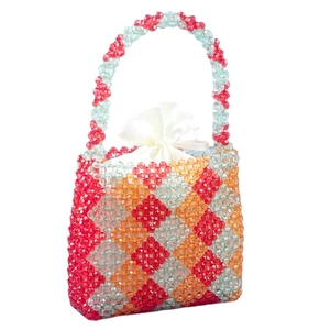 Handmade beaded handbag with red orange and blue geometric patterns and satin drawstring bag