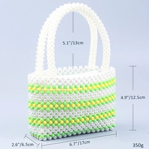Detail view of colorful beaded tote bag showing dimensions and striped weave pattern