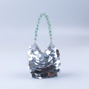 Silver sequin dinner clutch with translucent emerald green beaded handle for party