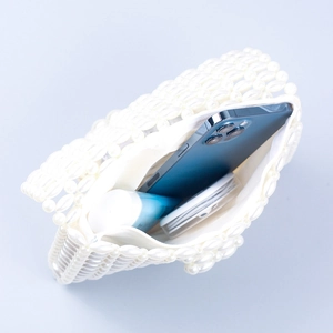 Elegant white pearl woven handbag with spacious interior for phone and cosmetics