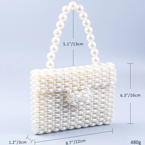 Detail showing dimensions of white pearl woven handbag with size and weight markers