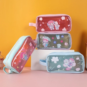 Detail of transparent PVC pencil case with glitter filling and anime characters
