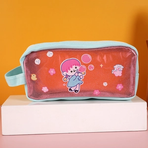 Close-up of mint green pencil case with transparent glitter PVC and cute cartoon girl pattern