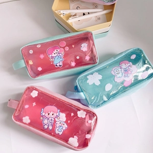 Detailed view of large transparent pencil cases with glitter liquid and cartoon girls